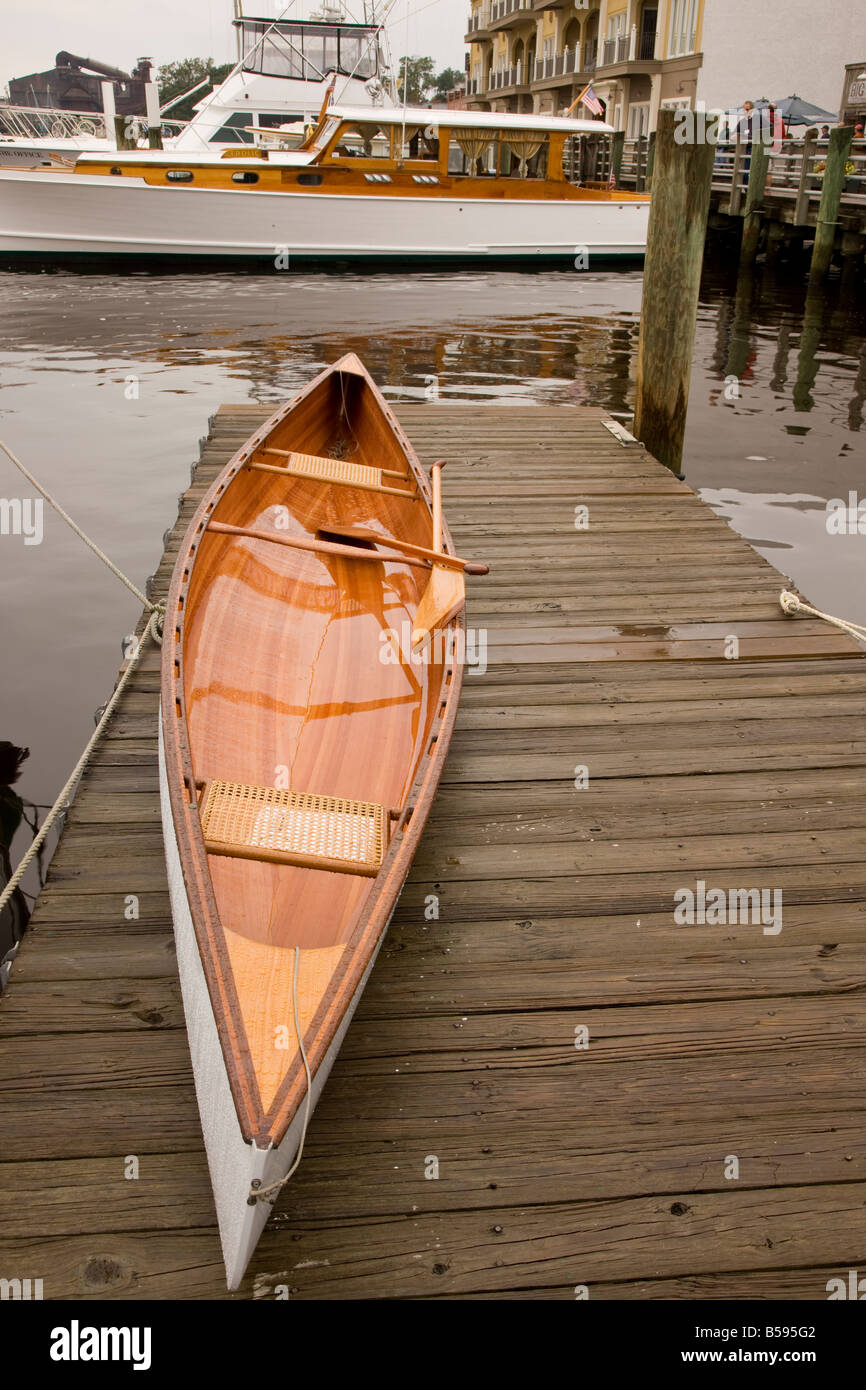 A wooden canoe lies on a dock in South Carolina with a