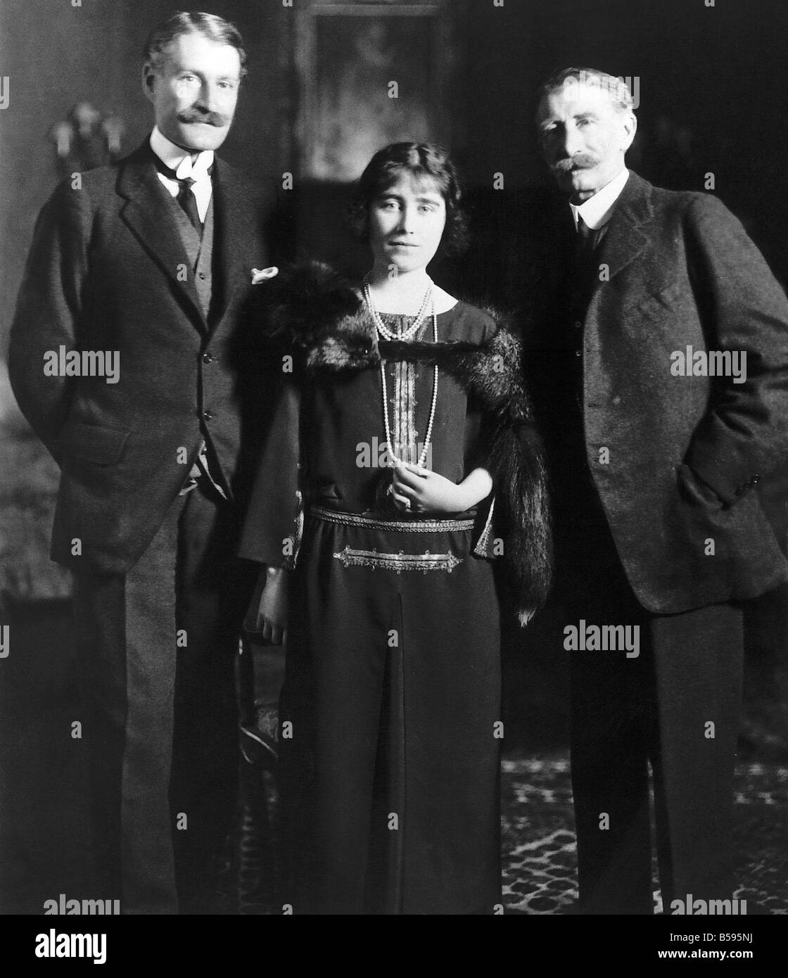 Queen Mother in 1923 standing with her father The Earl of Strathmore and eldest brother Lord Glamis at Glamis Castle Queen Mother Lady Elizabeth Bowes Lyon Stock Photo