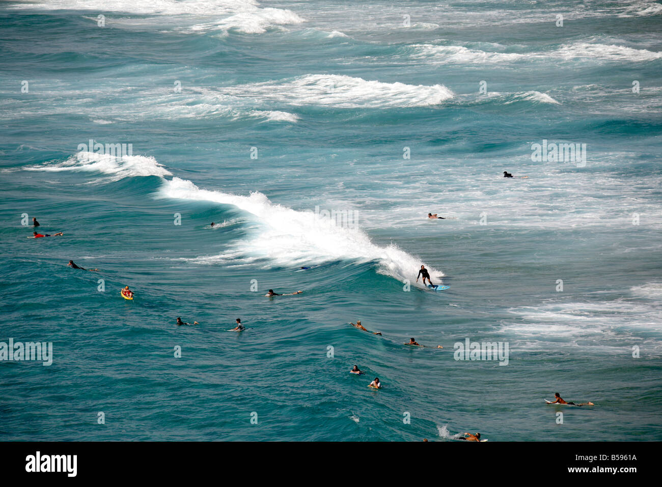People swimming and surfing in the sea from Main Beach on North Stradbroke Island Queensland QLD Australia Stock Photo