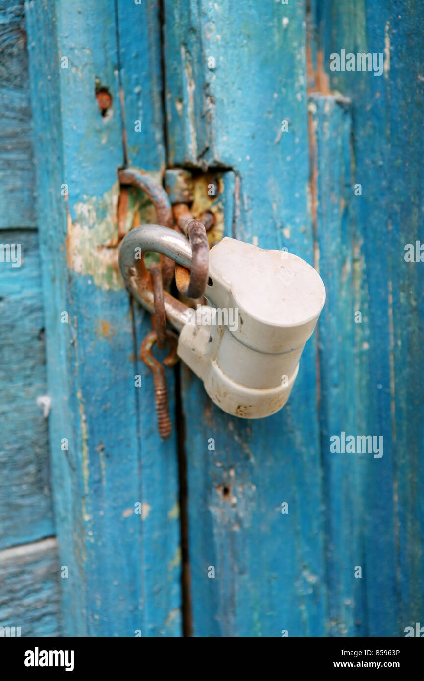 old metal lock on the wooden door Stock Photo - Alamy