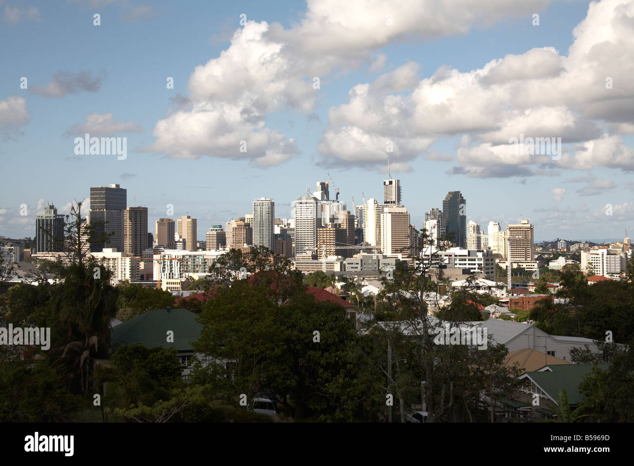 View of city centre business district buildings skyline beyond suburbs in Brisbane Queensland QLD Australia Stock Photo