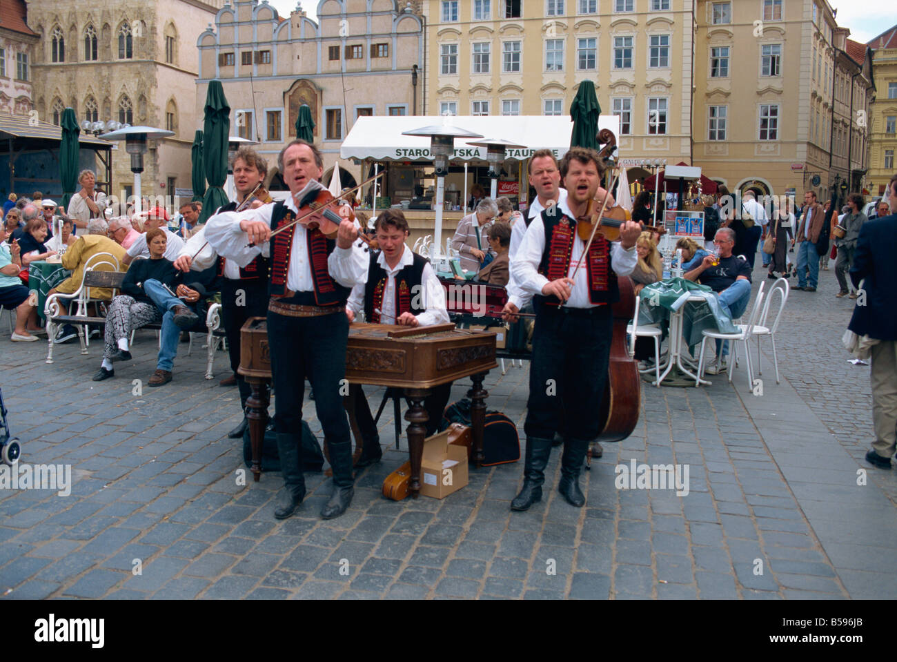 Musicians playing in city square, Prague, Czech Republic, Europe Stock Photo