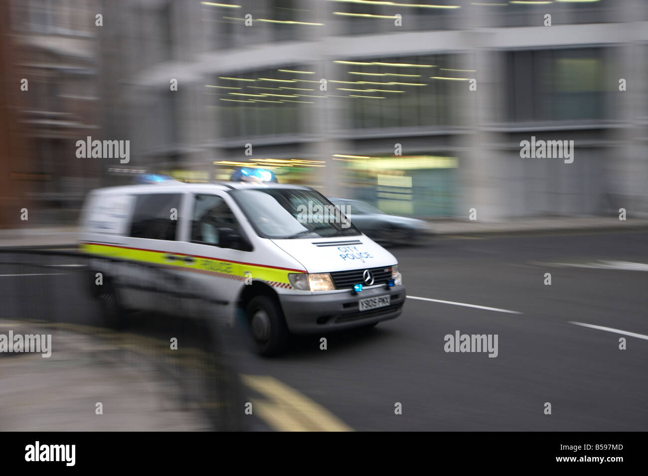 Police van with motion blur in City of London England Stock Photo