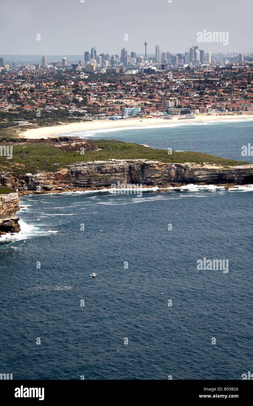 Aerial view north west of Maroubra Bay suburban houses and city skycrapers in distance Sydney NSW Australia High level oblique Stock Photo