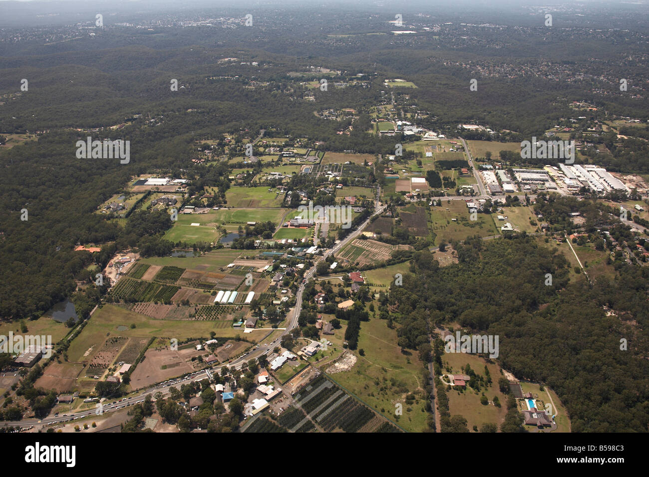 Aerial view south east of suburban houses and farms Old Northern Road