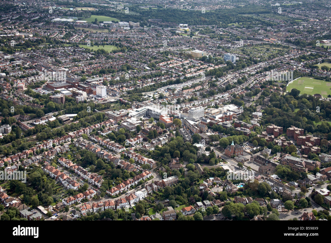 Aerial view north east of Hendon Lane railway line shops suburban houses tower blocks Victoria Recreation Ground Finchley London Stock Photo