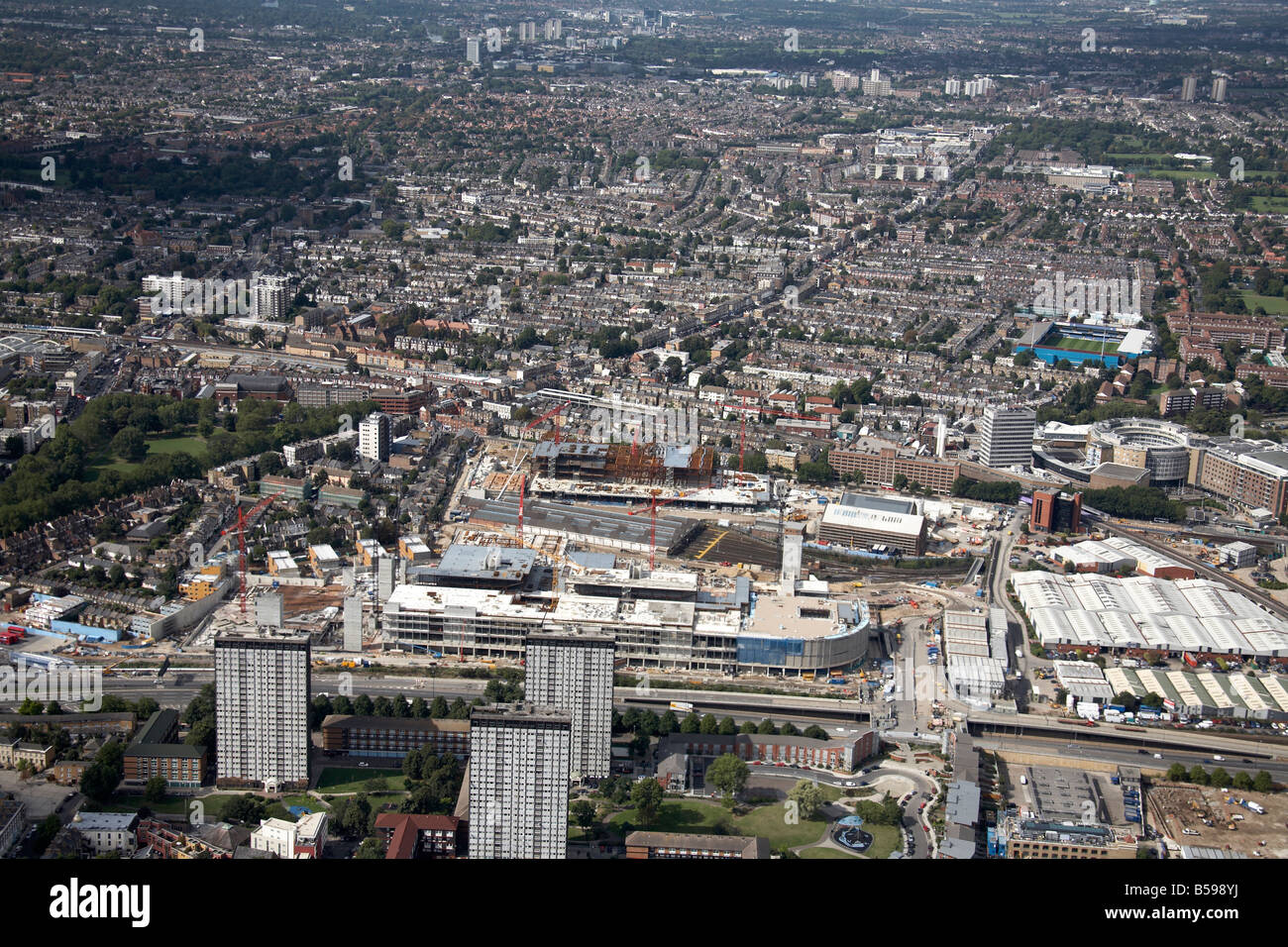 Aerial view south west of Westfield White City Construction Site BBC Television Centre suburban houses tower blocks London W11 W Stock Photo