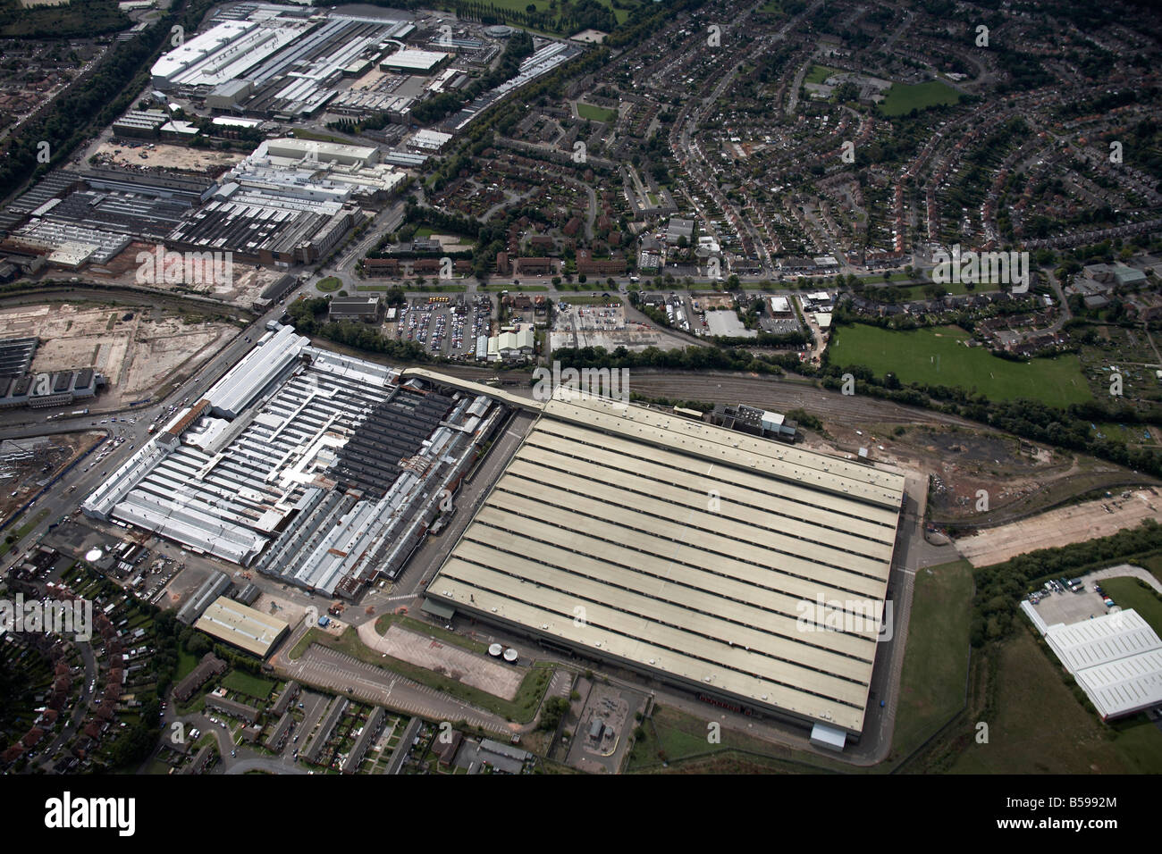 Aerial view south west of The New Works West and MG Rover Factory  suburban houses Lickey Road Rednal Birmingham B45 England UK Stock Photo