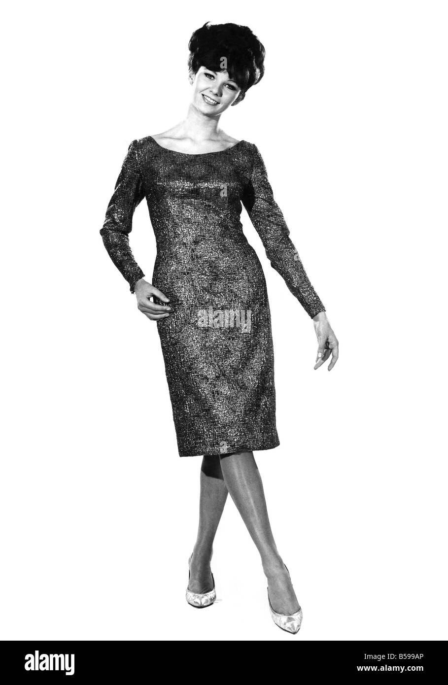 Reveille Fashions: Meriel Weston modeling a full sleeved evening dress. January 1964 P007610 Stock Photo