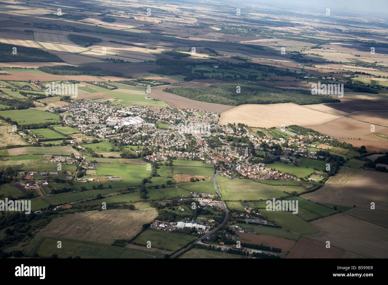 Aerial view north of suburban houses farms country fields Mill Street