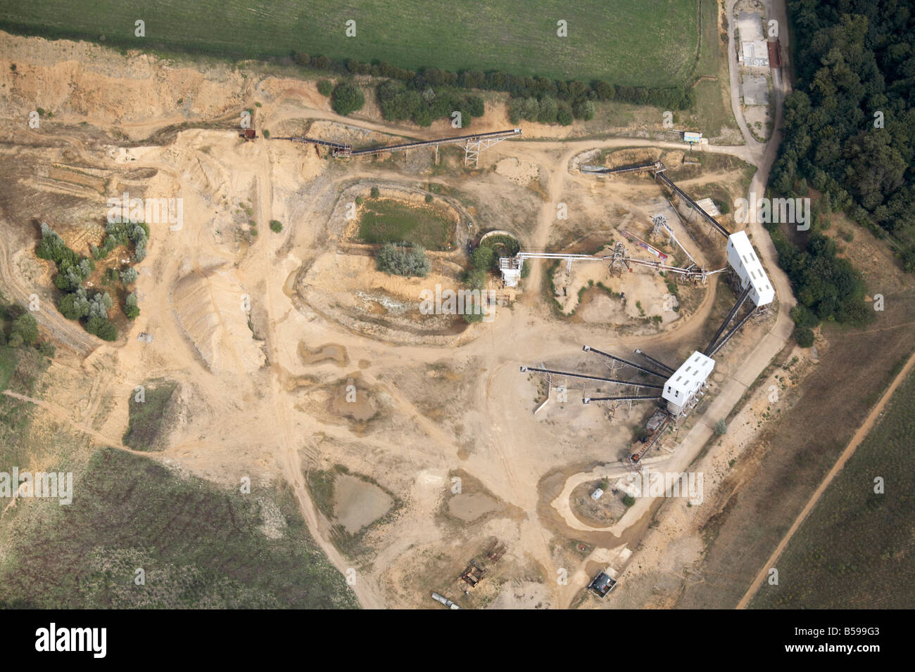 Aerial view east of construction site excavation work sand pit off Wadesmill Road Hertfordshire England UK High level oblique Stock Photo