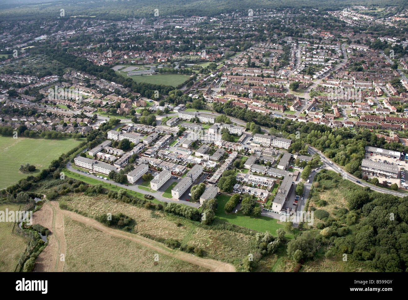 Aerial view north west of suburban houses apartment blocks Marles Croft Way Oakwood Hill playing fields Loughton London IG10 Eng Stock Photo