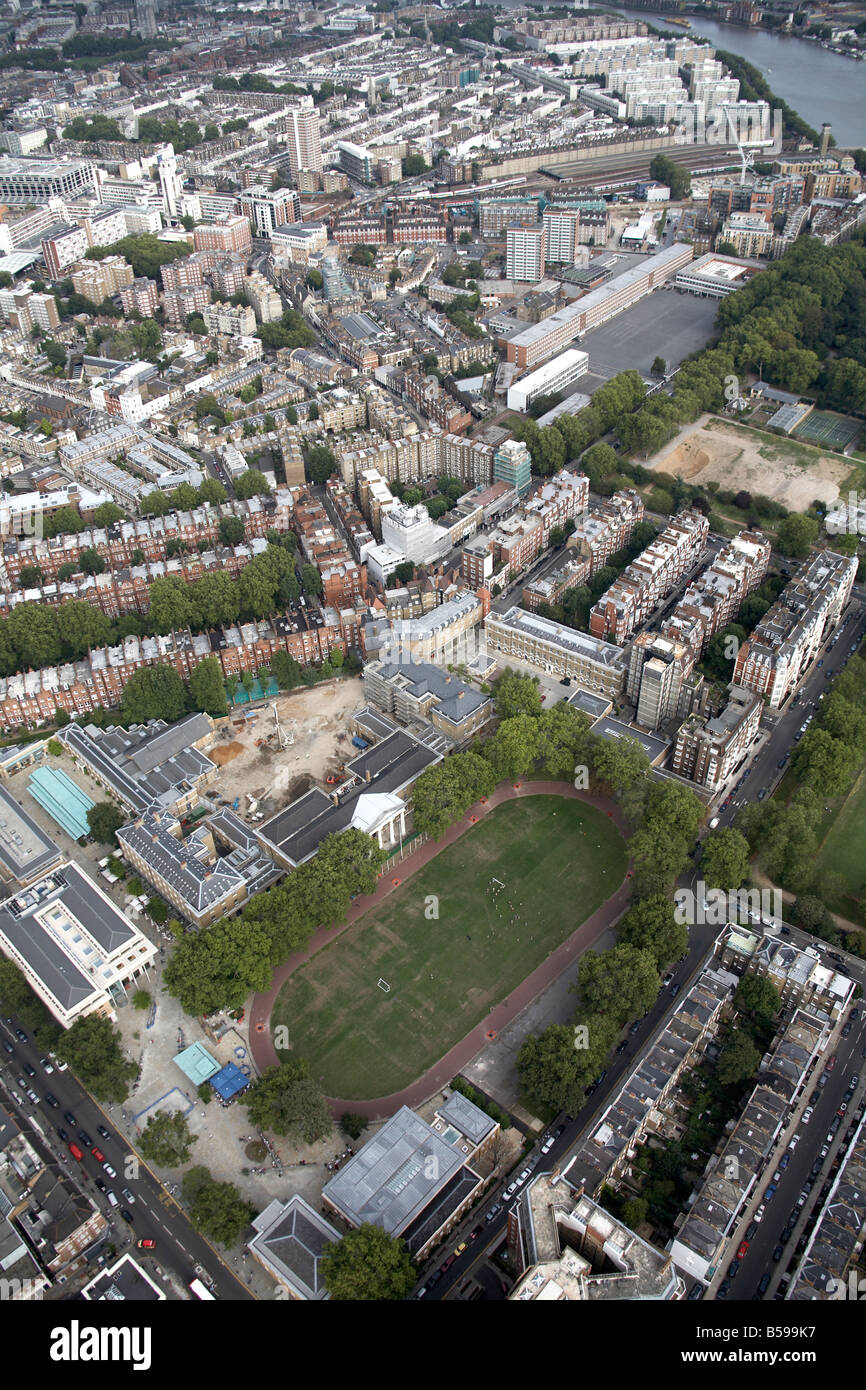 Aerial view south east of Duke of York s T A H Q race track sports fields King s Road inner city buildings Chelsea London SW3 En Stock Photo