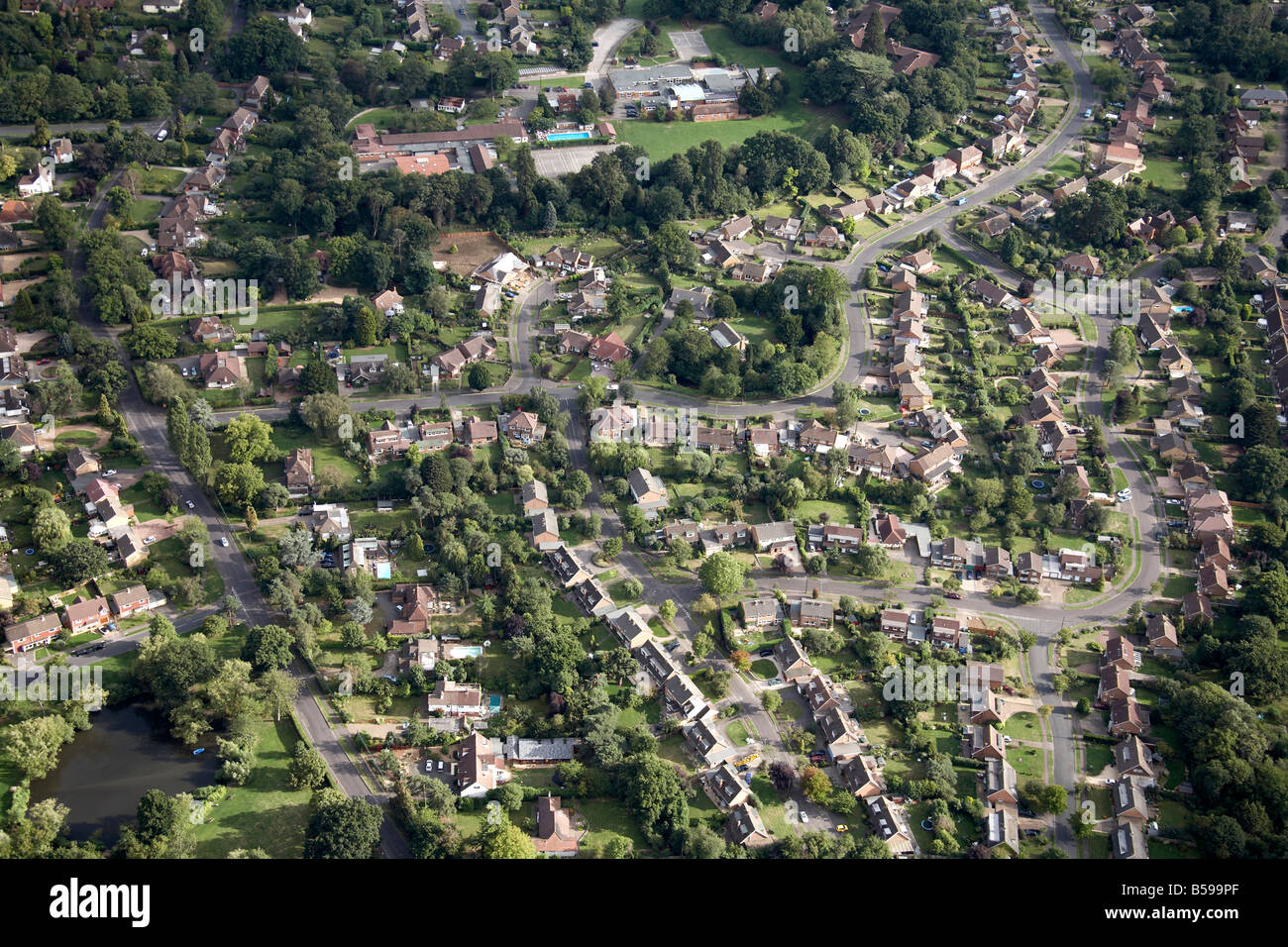 Aerial view south east of suburban houses gardens Eastwick Drive Eastwick Park Ave Great Bookham