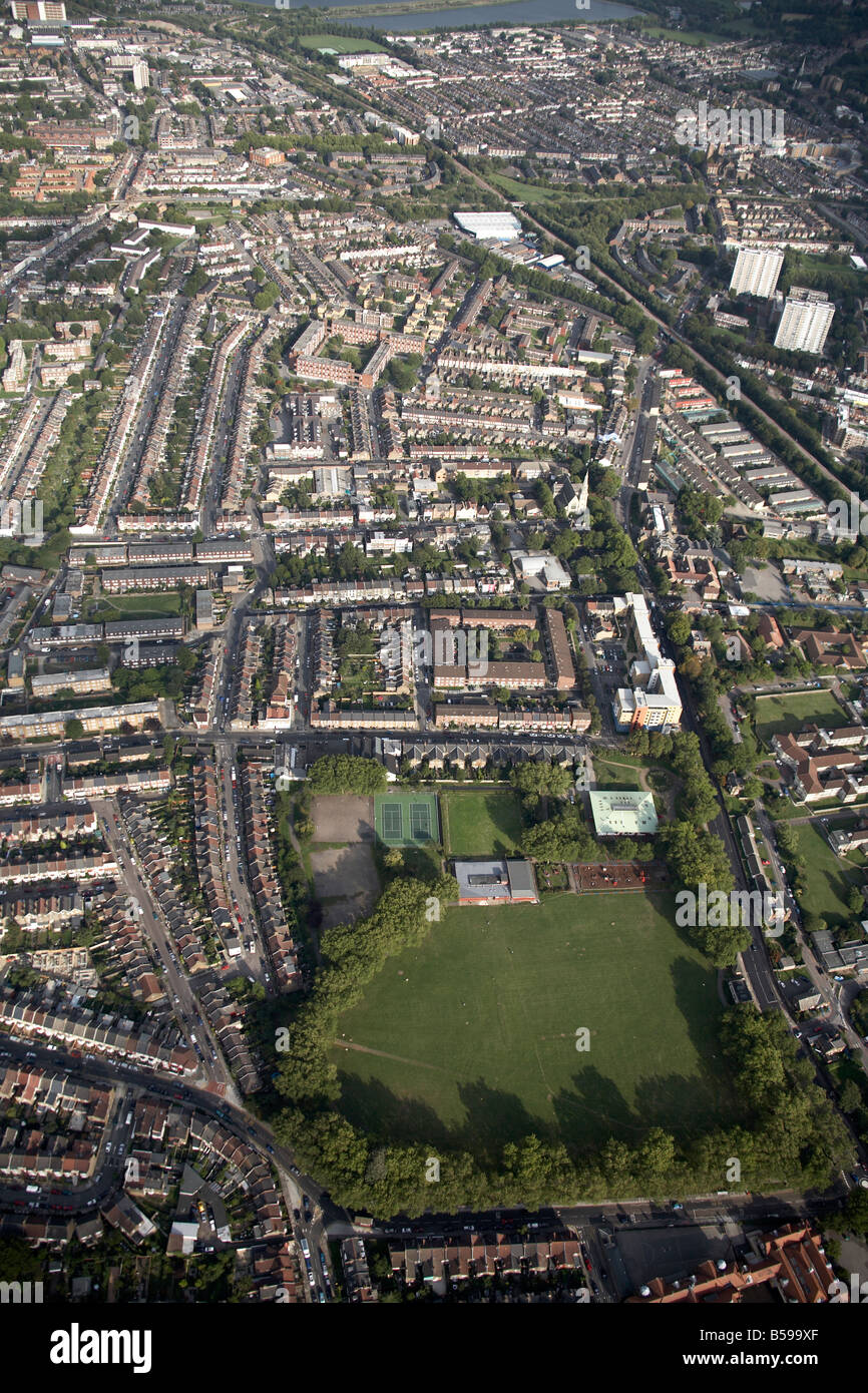 Aerial view south east of Chestnuts Recreation Ground railway line suburban houses tower blocks South Tottenham London N15 UK Stock Photo