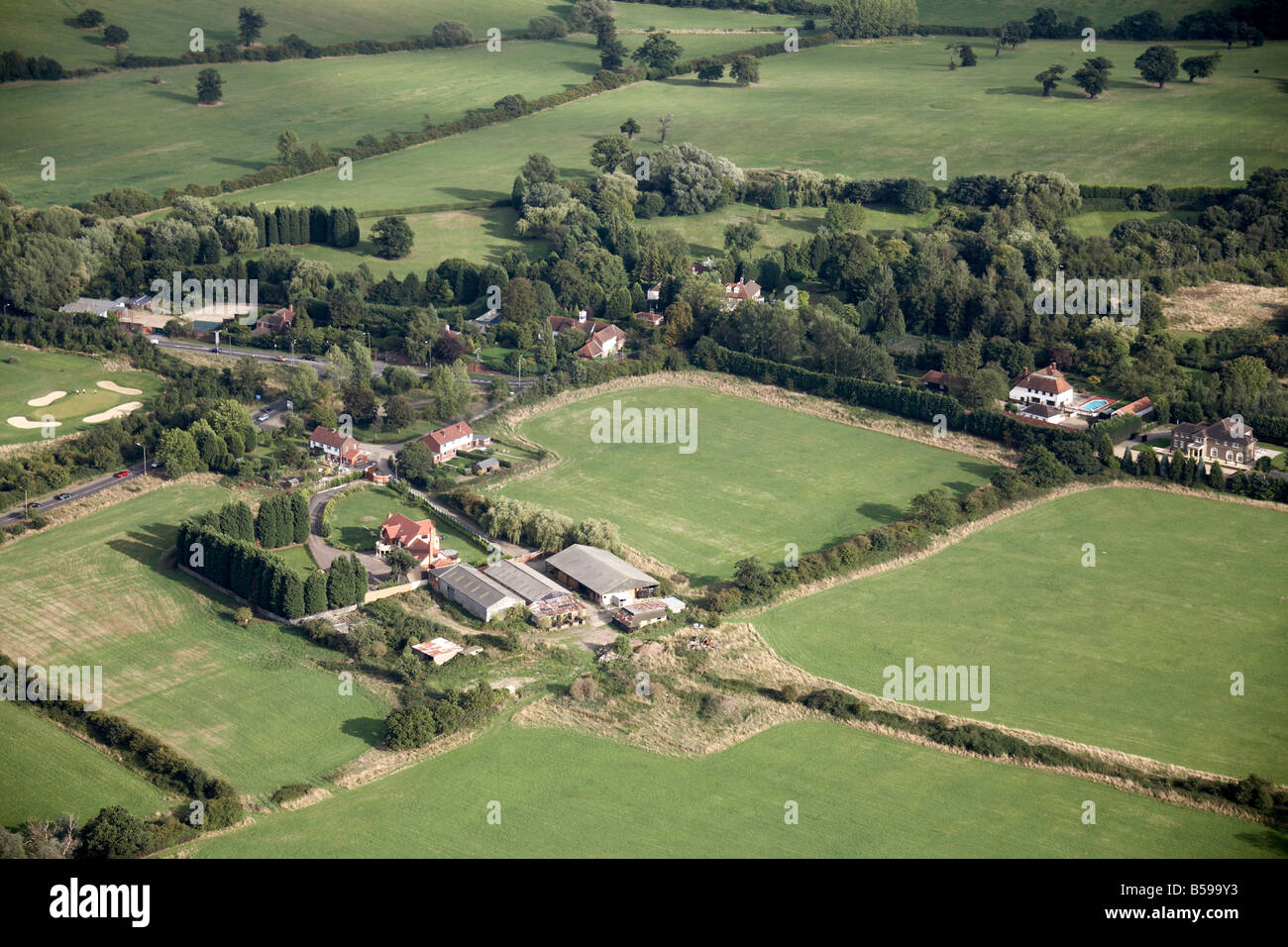 Aerial view south east of Home Farm Rolls Park Farm country fields