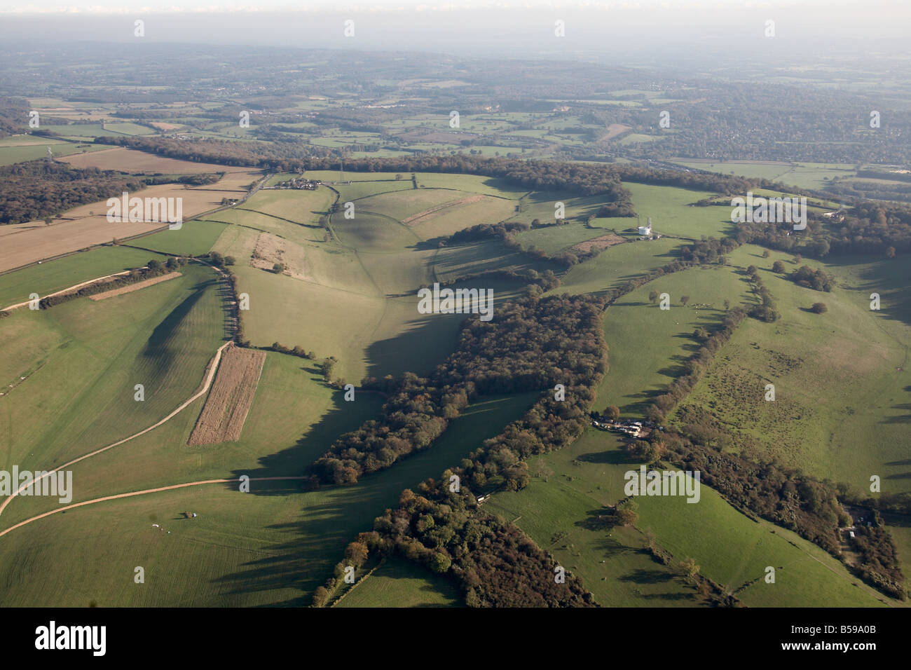 Aerial view south east of country fields trees Westerham Oxted Tandridge London TN16 RH9 England UK Stock Photo