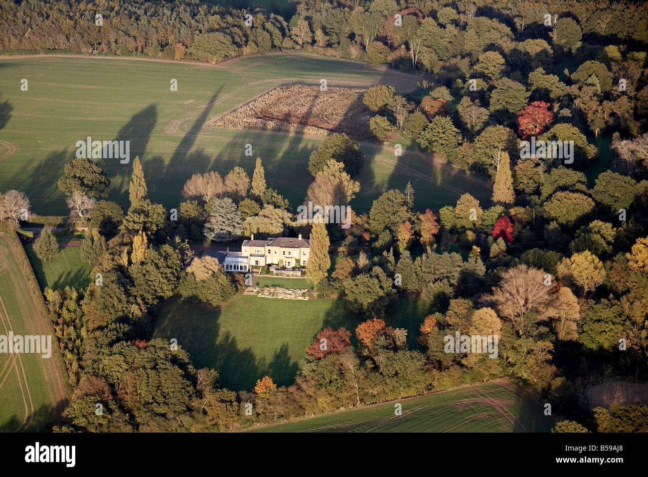 Aerial view north east of country house and garden country fields trees