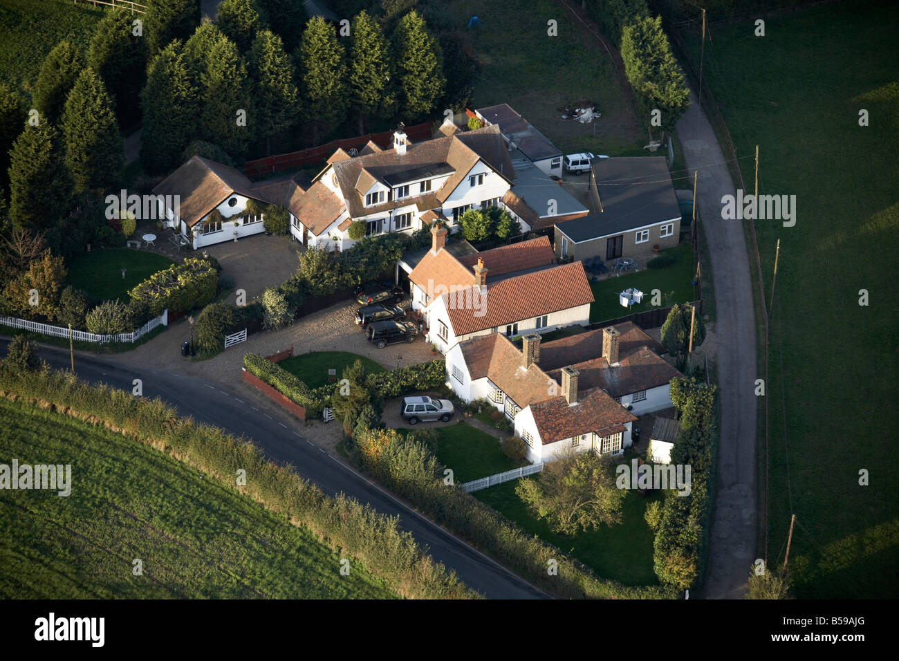 Aerial view north east of country houses conifer trees New Road Lambourne Romford Epping Forest London RM4 England UK Stock Photo