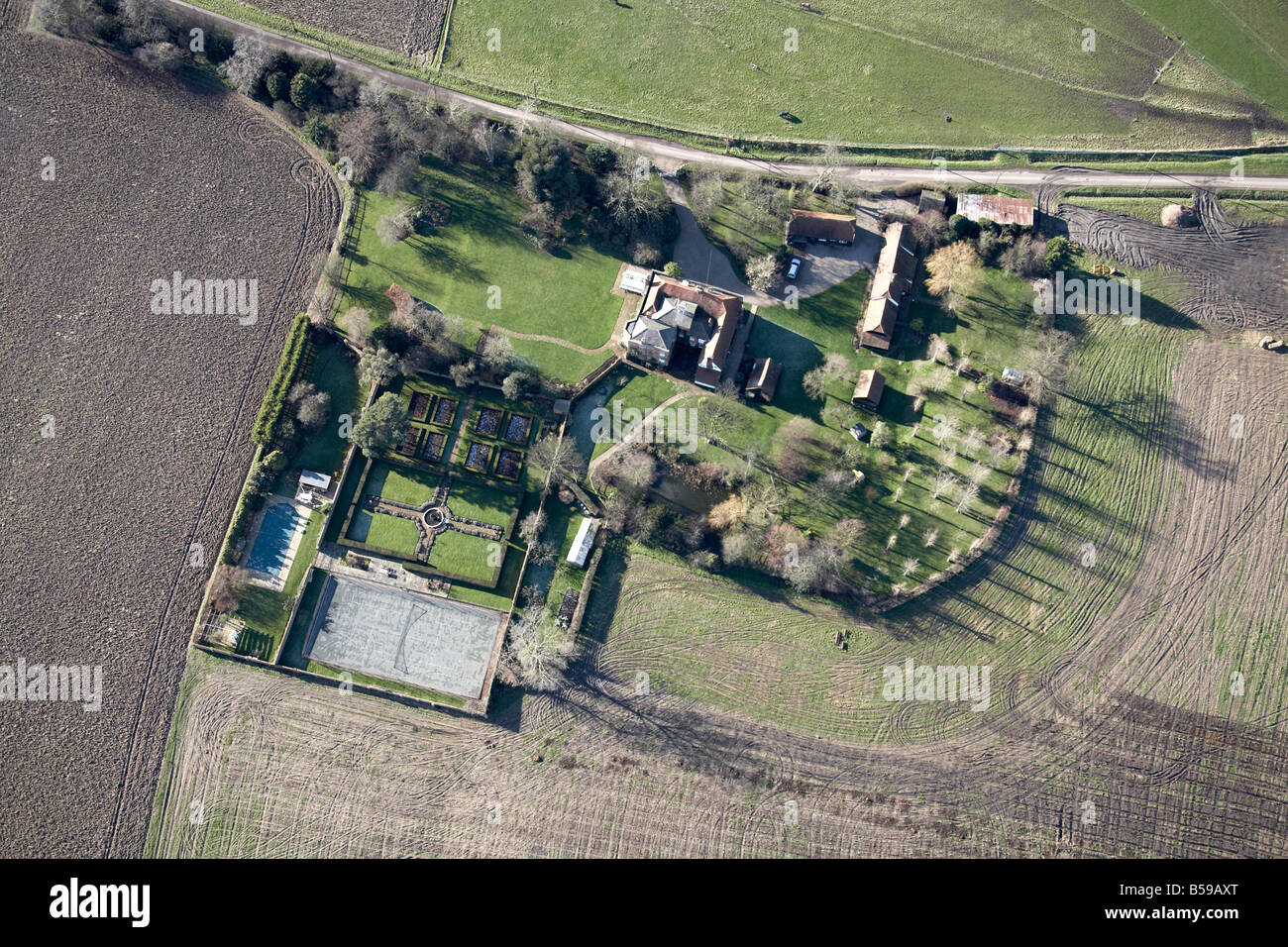 Aerial view south west of country houses gardens fields Romford Epping Forest Essex RM4 England