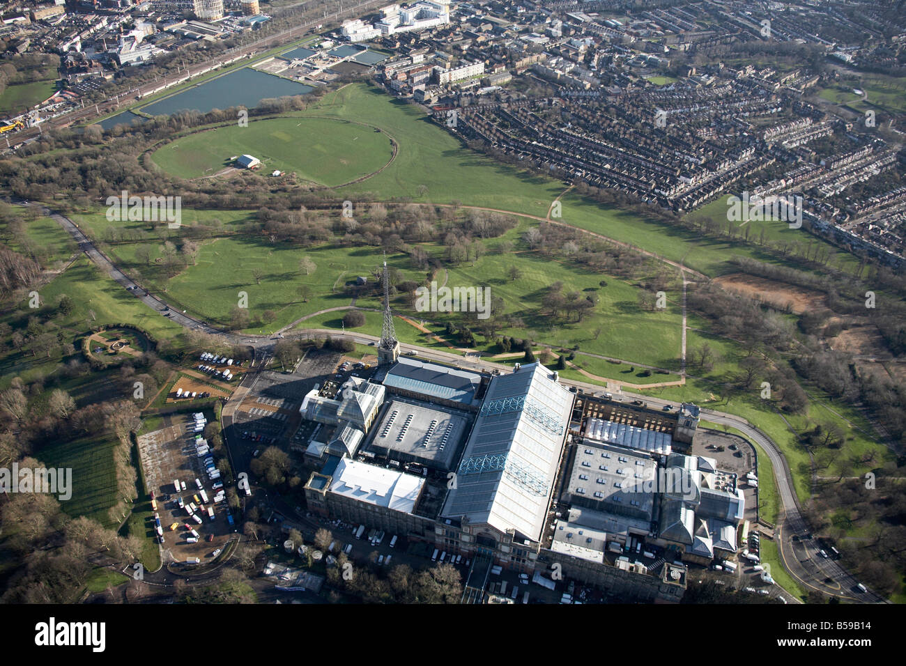 Aerial view south east of Alexandra Palace Park cricket club reservoir filter beds suburban houses Hornsey London N22 N8 England Stock Photo