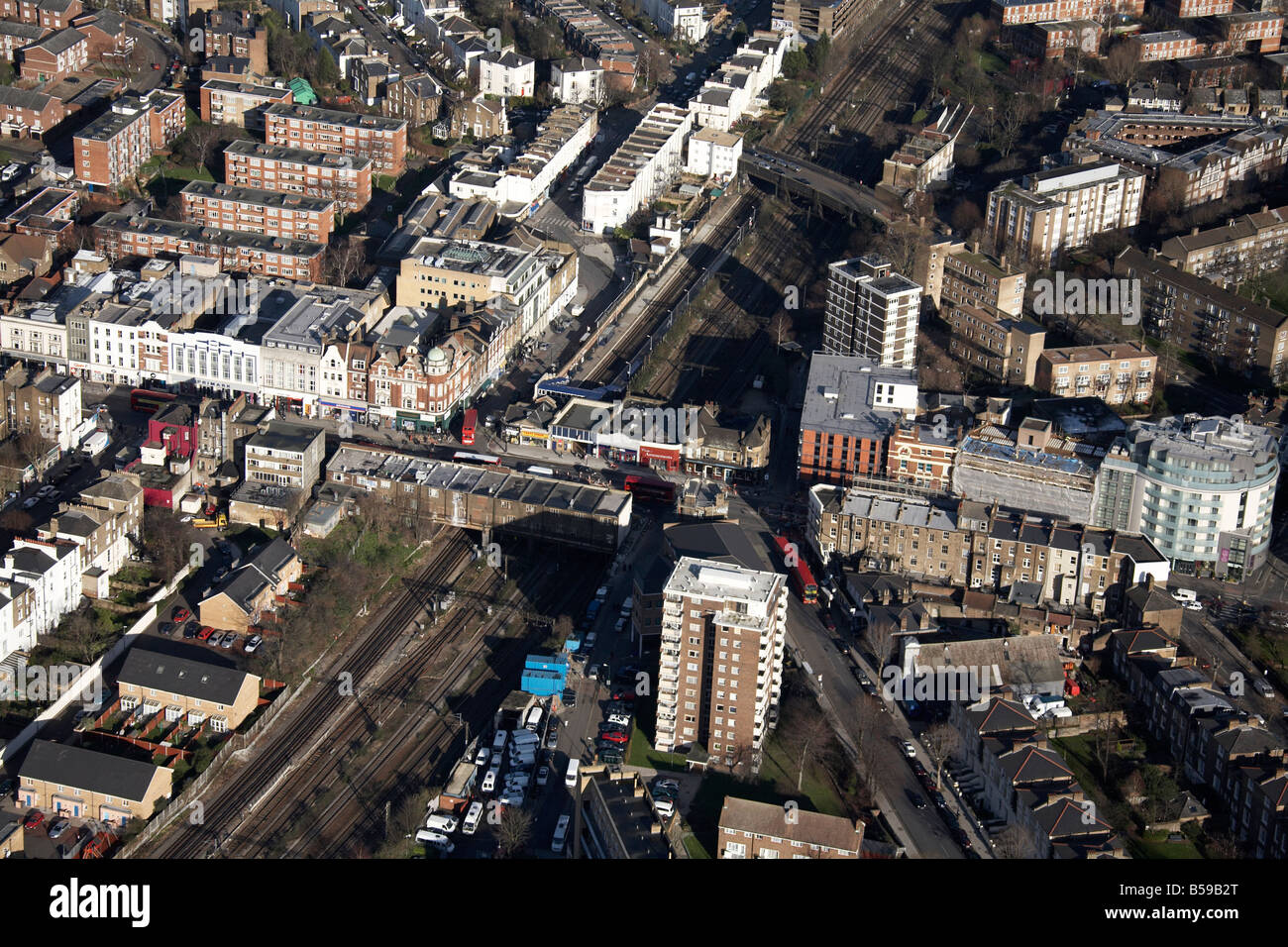 Aerial view north east of Kilburn High Road Cambridge Avenue shops suburban houses tower blocks railway line London NW6 NW8 UK Stock Photo