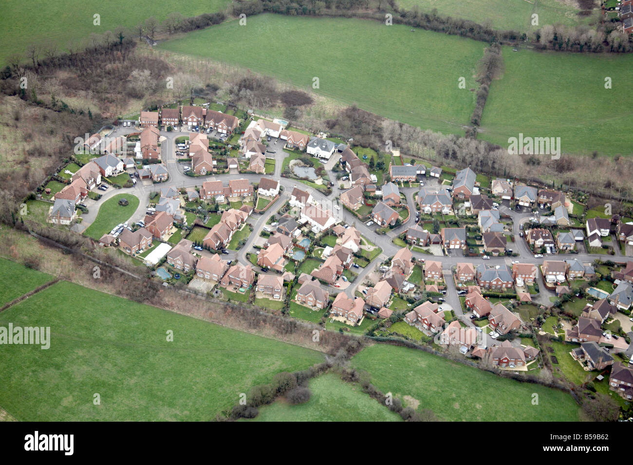 Aerial view south west of suburban housing estate country fields Epping Forest Greater London England UK Stock Photo