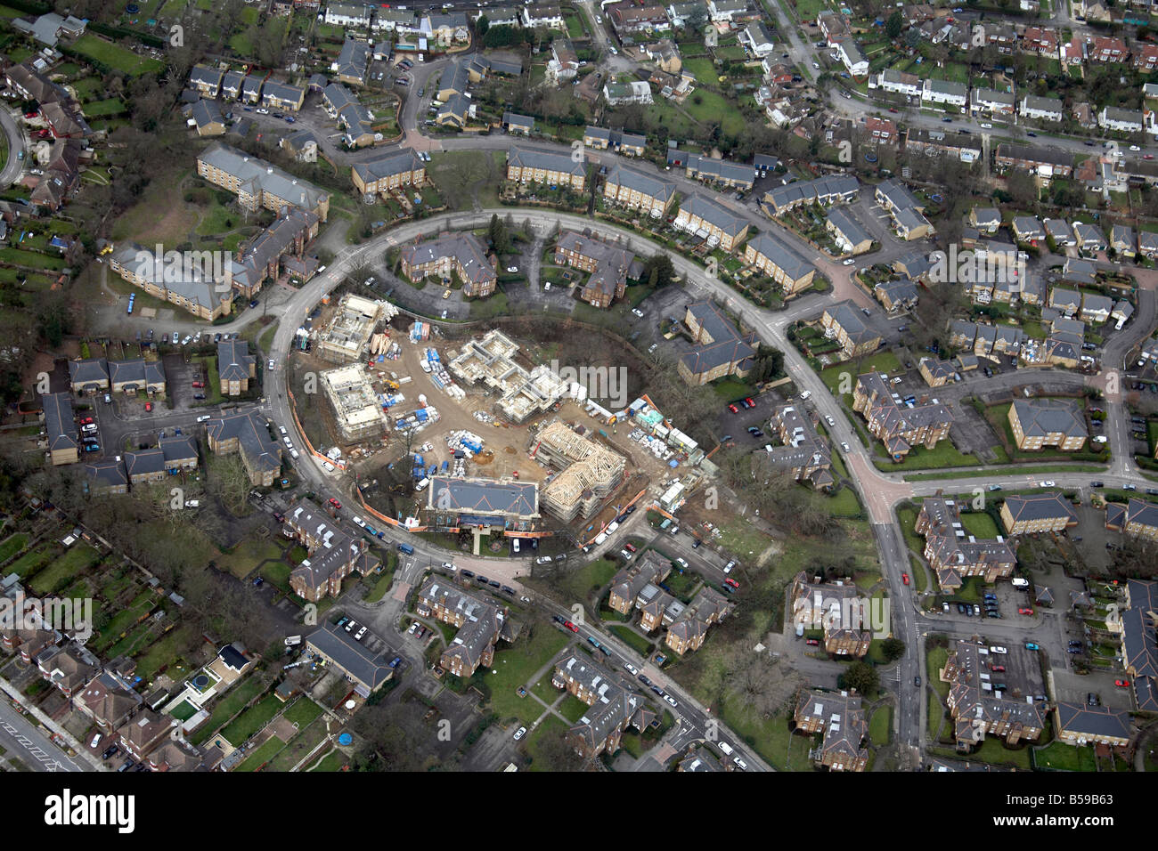 Aerial view south west of suburban housing estate construction work Epping Forest Greater London England UK Stock Photo