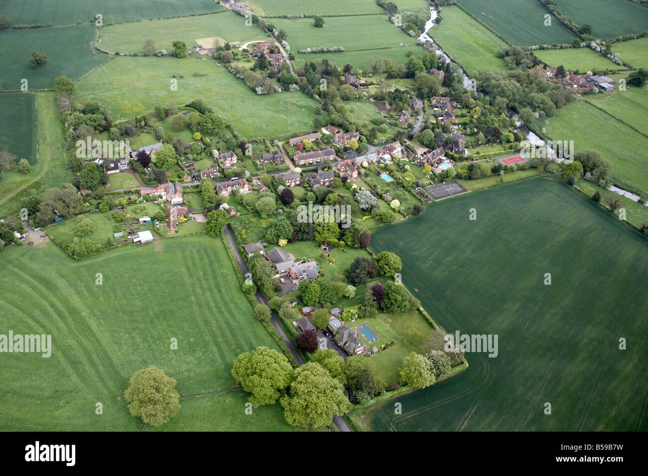 Aerial view south east of Ashow Village Rocky Lane country houses fields forestation tennis courts River Avon Warwickshire CV8 U Stock Photo