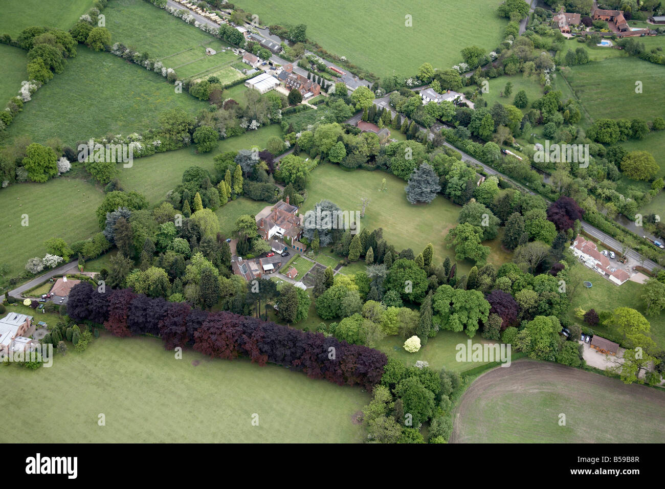 Aerial view south of private country houses fields gardens canal Grove