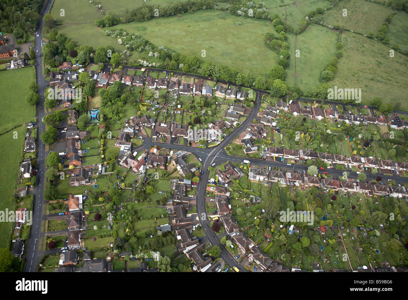 Aerial view north east of suburban houses fields trees Alcester Road Gorsey Lane Manor Road Ann Road Wythall B47 England UK Stock Photo
