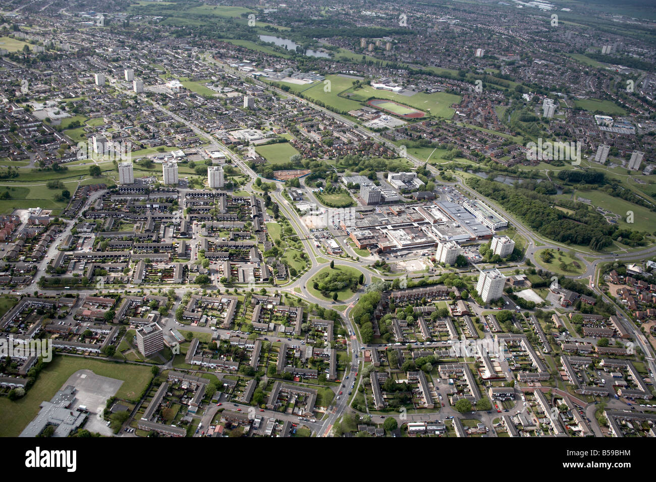 Aerial view north west of suburban houses tower blocks shopping centre