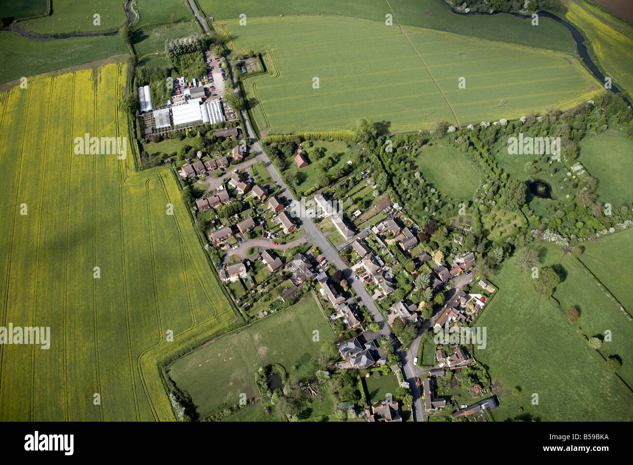 Aerial view north east of country farm houses fields Kings Newnham Road