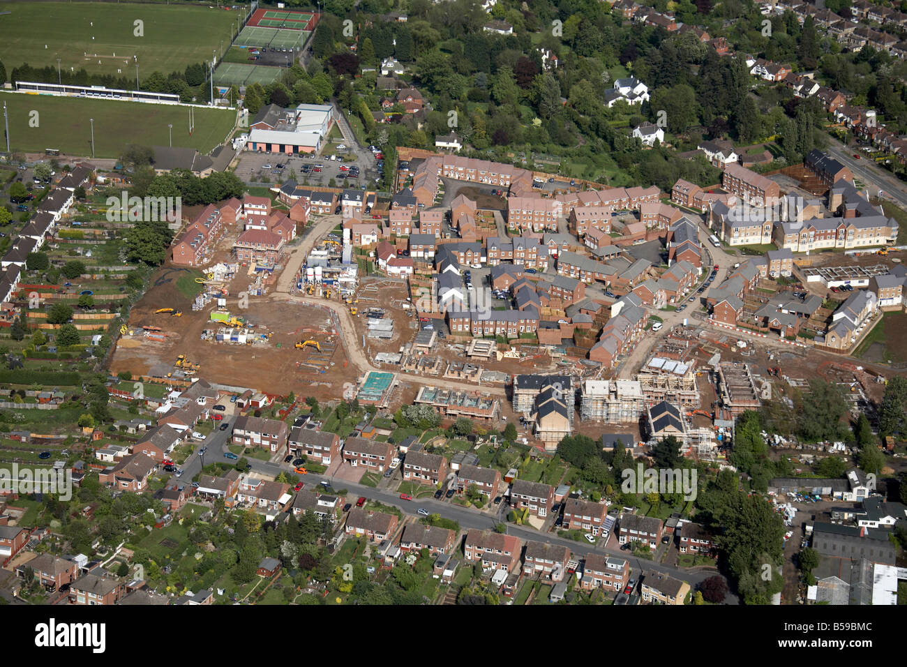 Aerial view north east of suburban housing development under construction Rugby Lions Football