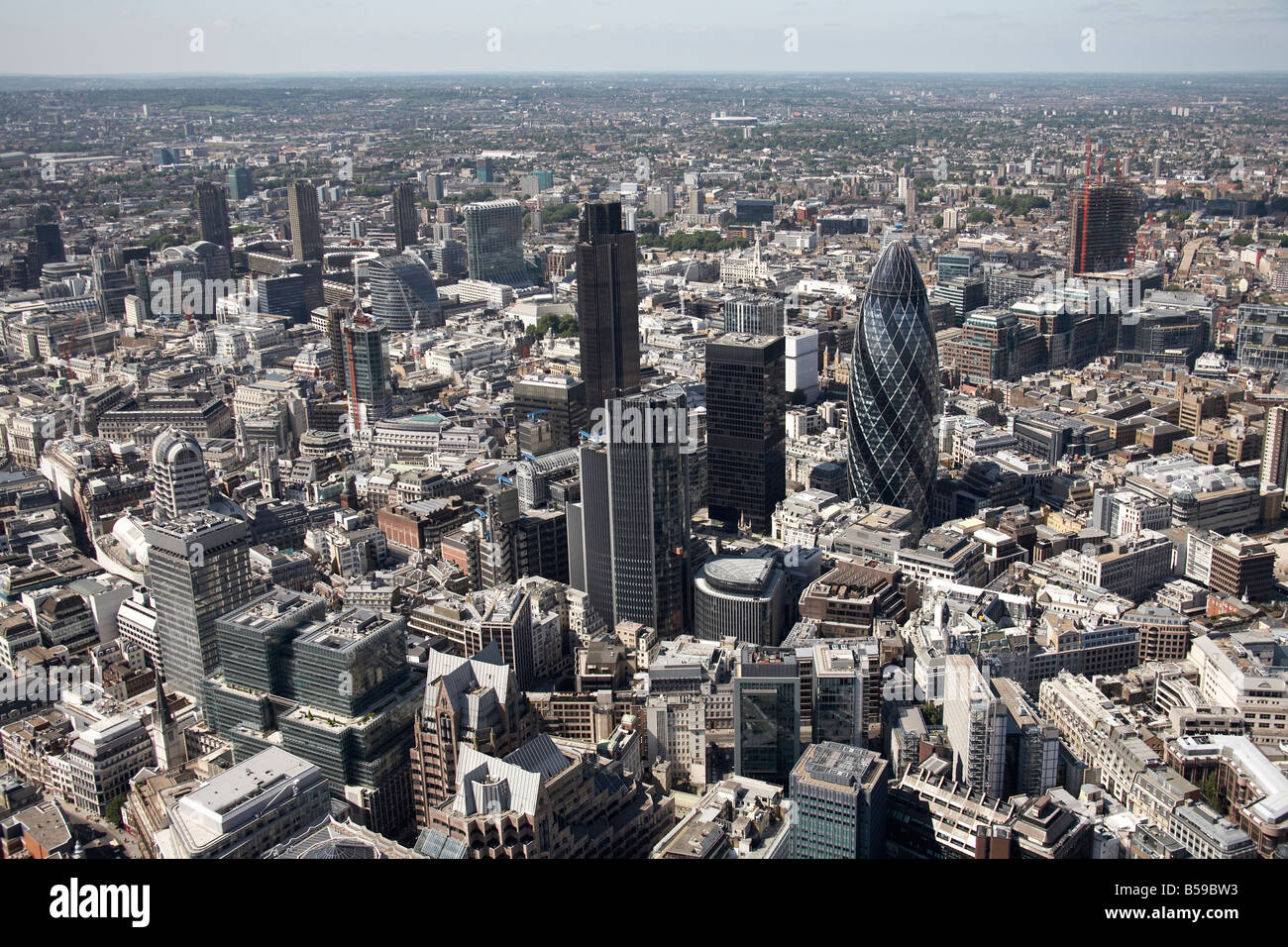 Aerial north west of inner city buildings tower blocks Gherkin Building 99 Bishopsgate The NatWest Tower The City of London EC3 Stock Photo