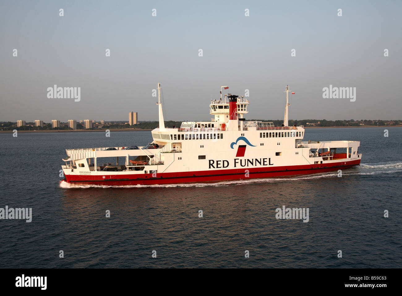 Red Funnel passenger ferry catamaran sailing on on Southampton Water in evening light England UK 200705 QE Boat United Kingdom U Stock Photo