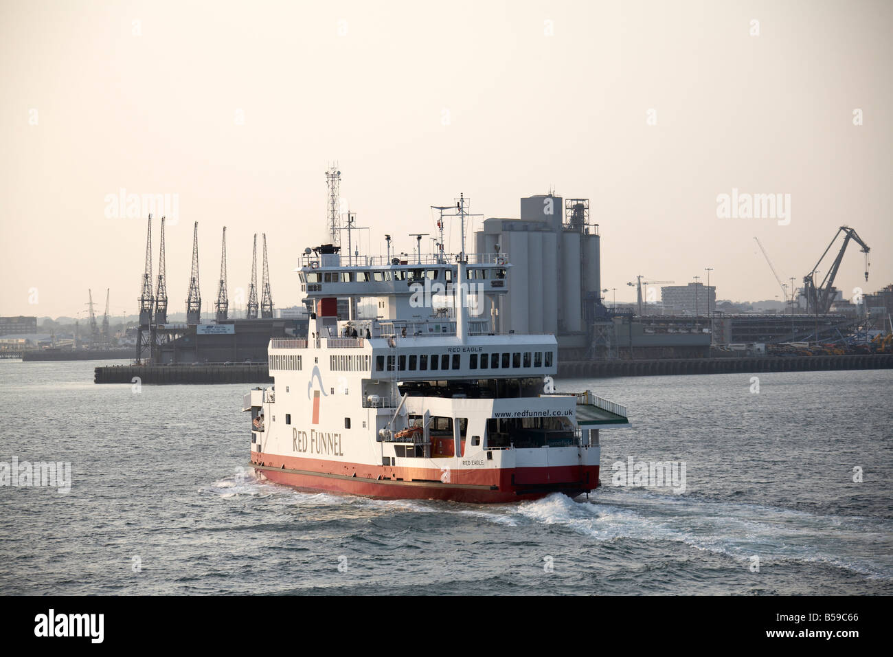 Red Funnel passenger ferry catamaran sailing on on Southampton Water in evening light England UK 200705 QE Boat United Kingdom U Stock Photo