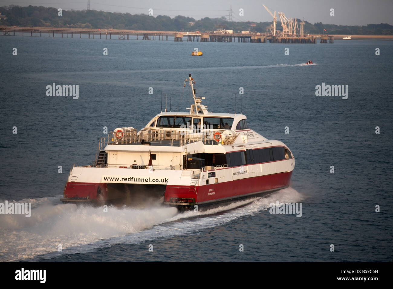 Red Funnel passenger ferry catamaran sailing on on Southampton Water in