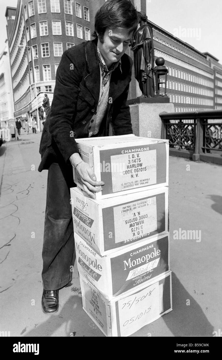 Crowds of people have been trying to beat the budget with the proposed increase in alcohol prices. Our Picture Shows: One of the pre budget shoppers outside the Augustus Barnett wine shop in Holborn after buying his alcohol, he just has to figure out how to get it home.. April 1975 75-1911-004 Stock Photo