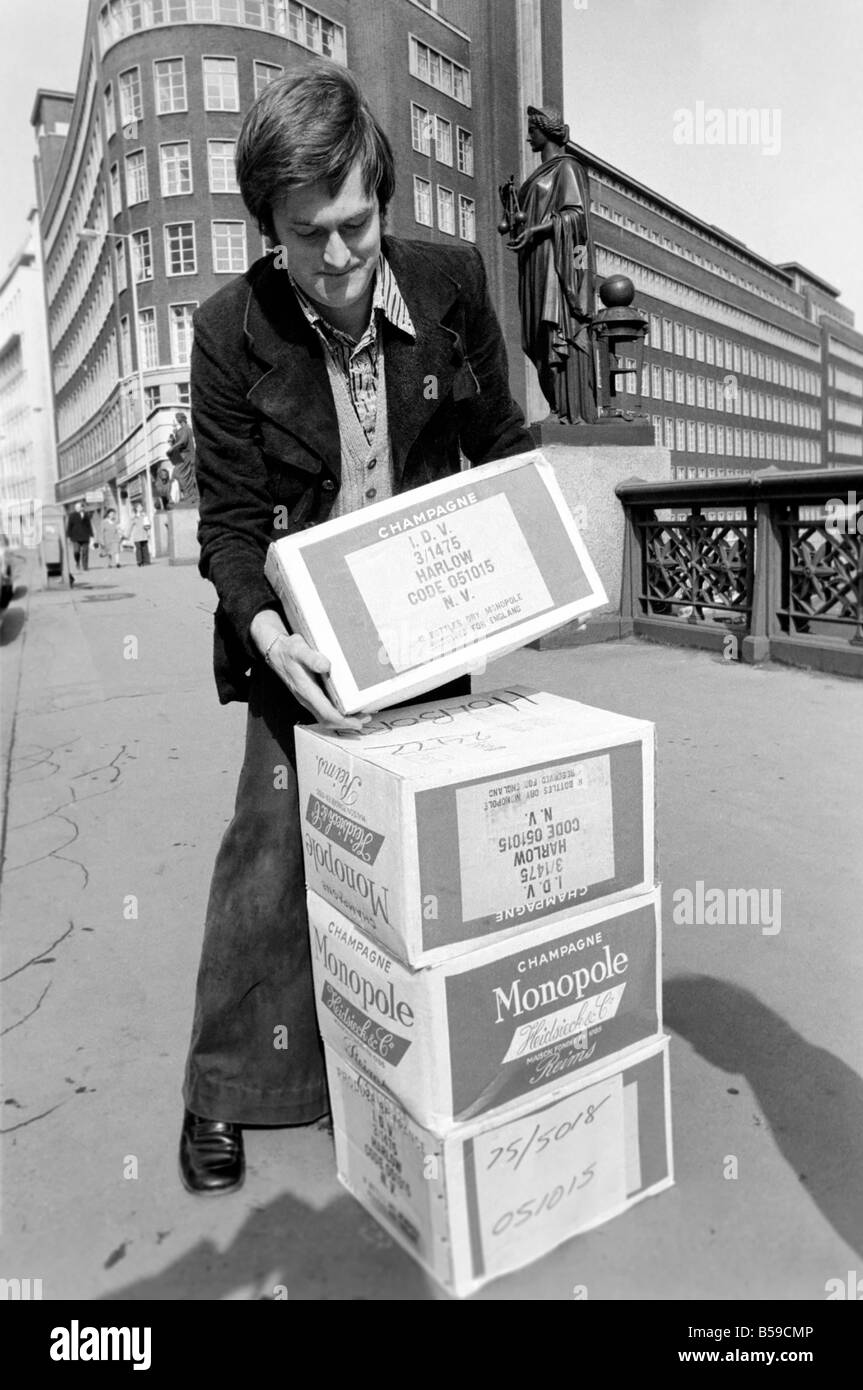 Crowds of people have been trying to beat the budget with the proposed increase in alcohol prices. Our Picture Shows: One of the pre budget shoppers outside the Augustus Barnett wine shop in Holborn after buying his alcohol, he just has to figure out how to get it home.. April 1975 75-1911-005 Stock Photo