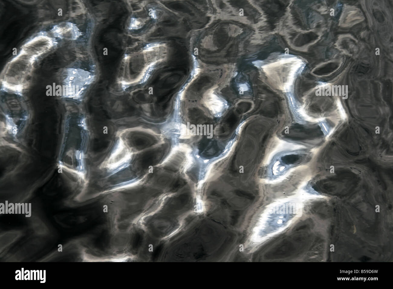 sun light reflection waves on lake water surface Stock Photo - Alamy