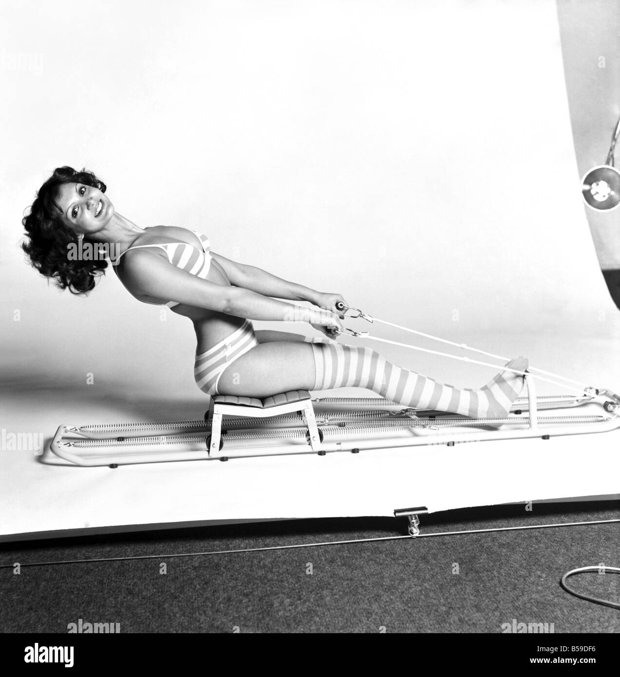 Exercise machine model Stephanie Marrian having a good workout. &#13;&#10;February 1975 &#13;&#10;75-01078 Stock Photo
