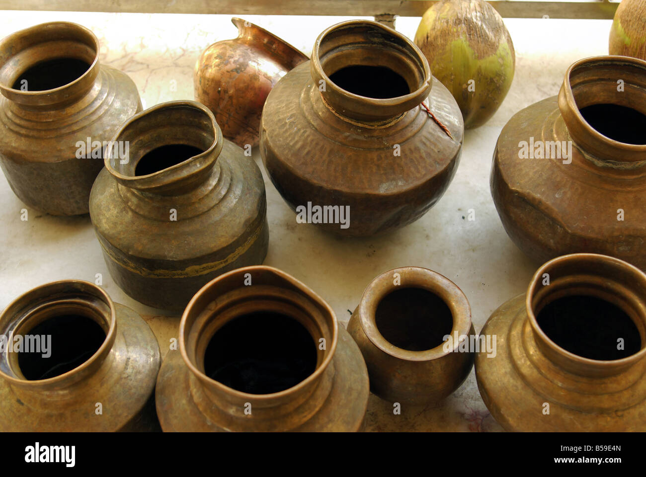 Copper water vessel used in Hindu temple, Gujarat, India Stock Photo