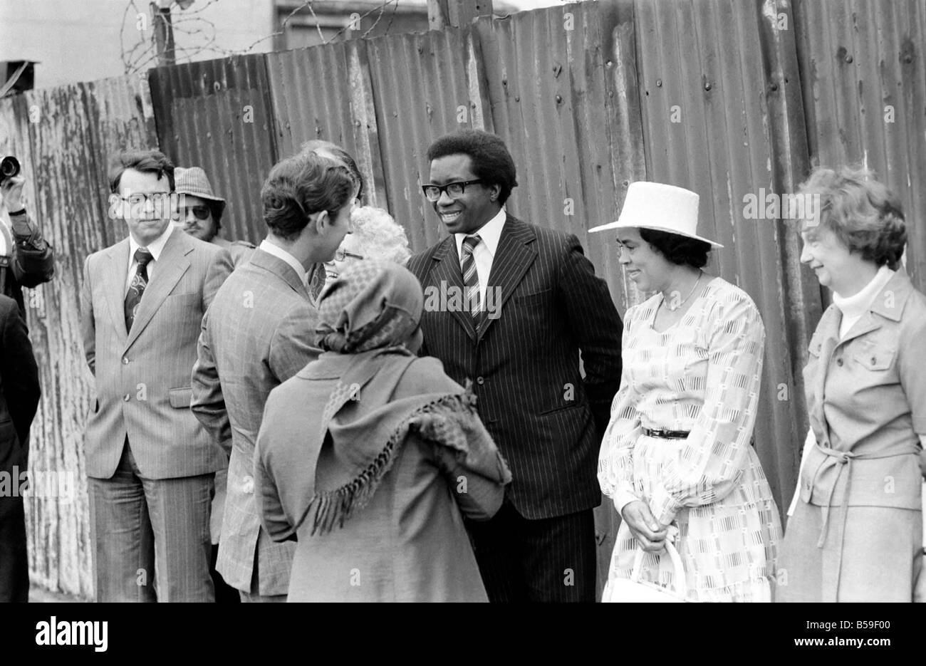 Prince Charles talking to Mr. Kim Gordon (wearing glasses and black jacket) the Secretary of the Defence Committee for the 24, during his visit to the Moonshot Youth Club, Lewisham, today. ;June 1977 ;R77-3374-002 Stock Photo