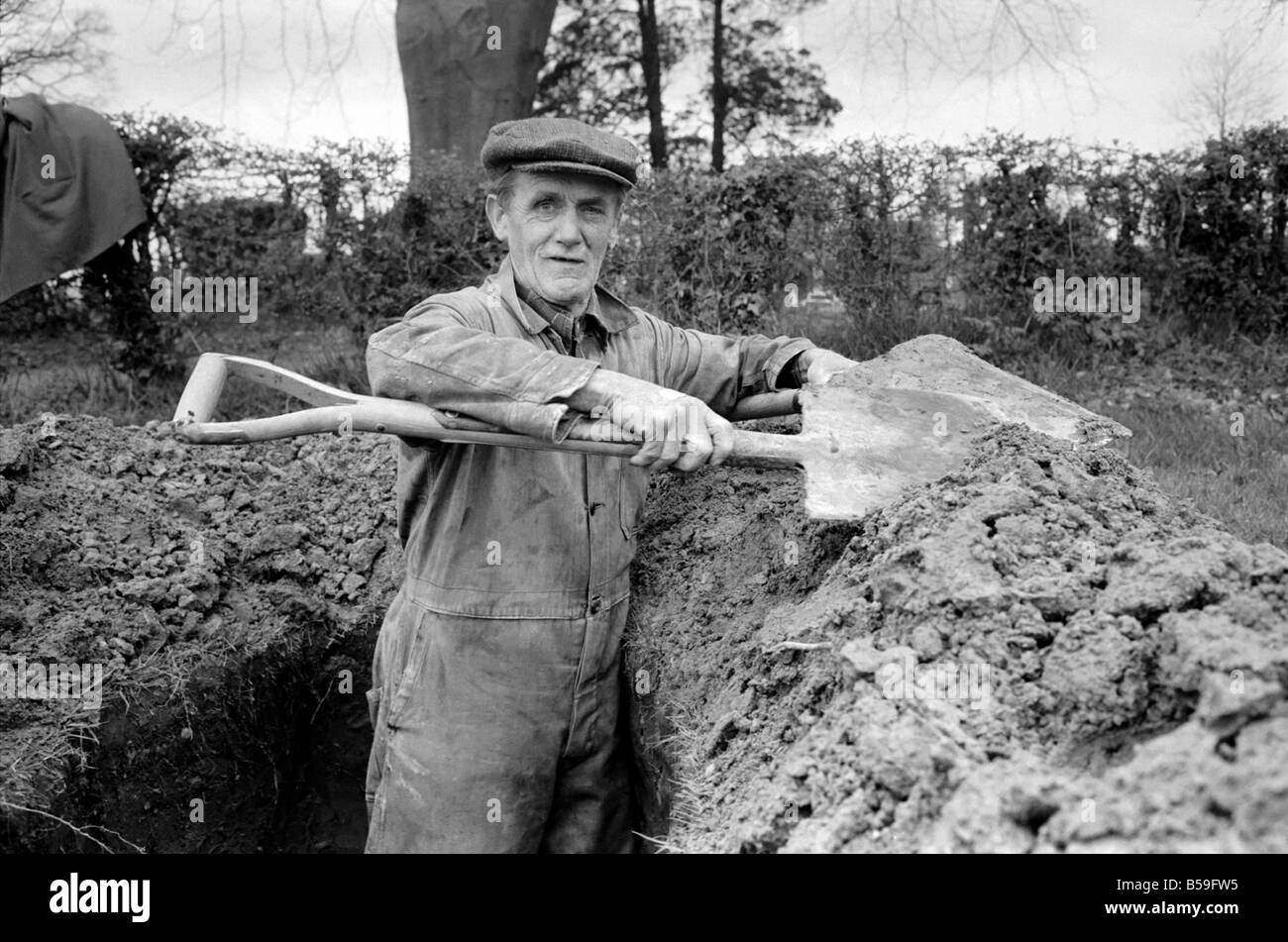 Is work wonderful?. Feature. Grave Digger at work in the grave yard of