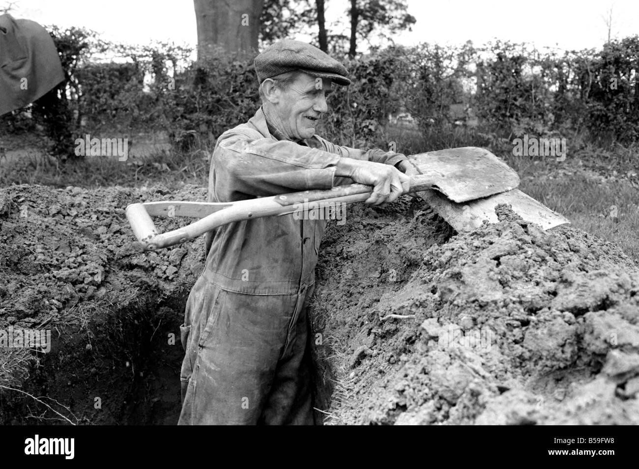 Is work wonderful?. Feature. Grave Digger at work in the grave yard of