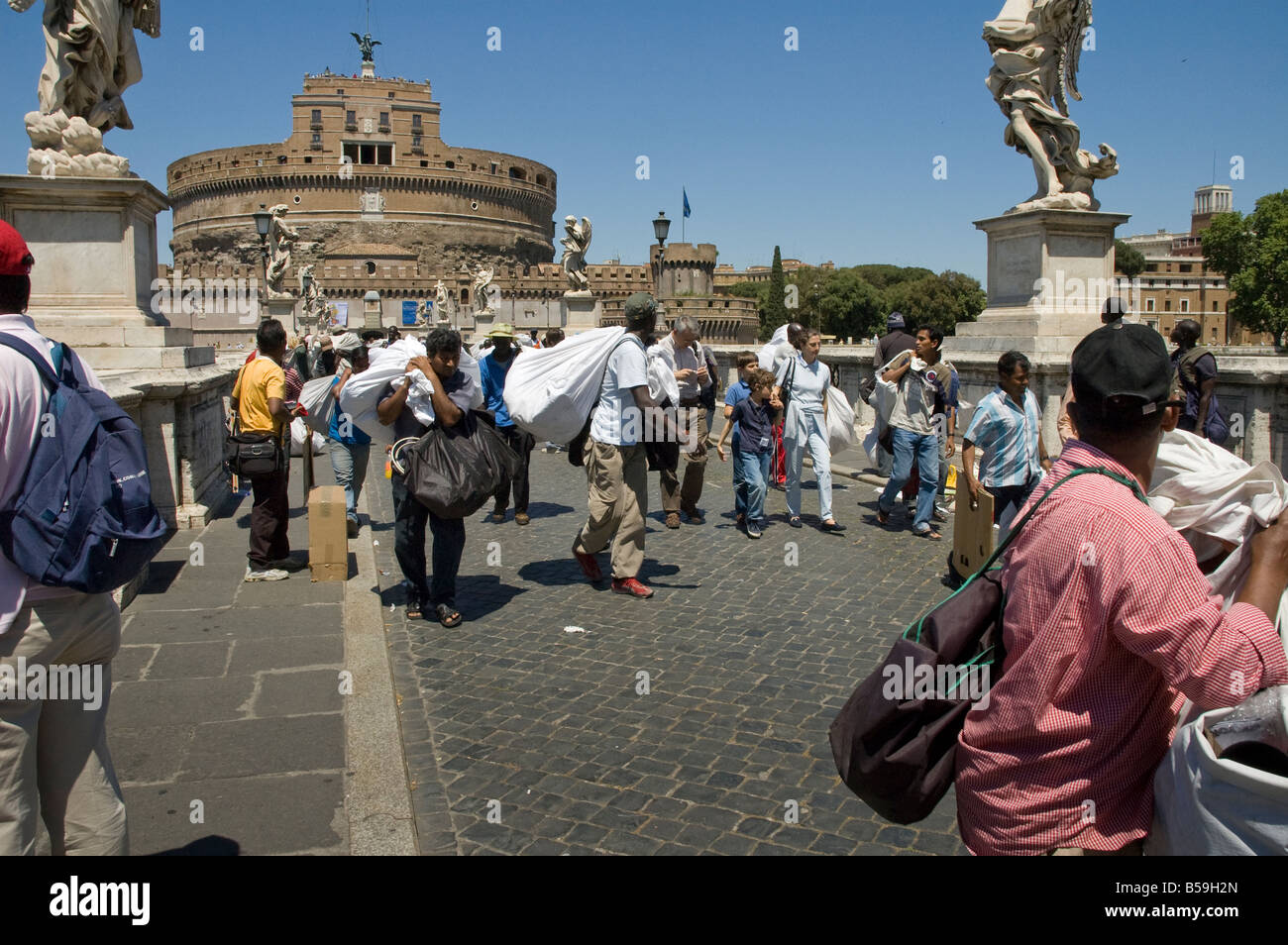 Street Traders on the Ponte Sant Angelo being moved on by the police Stock Photo