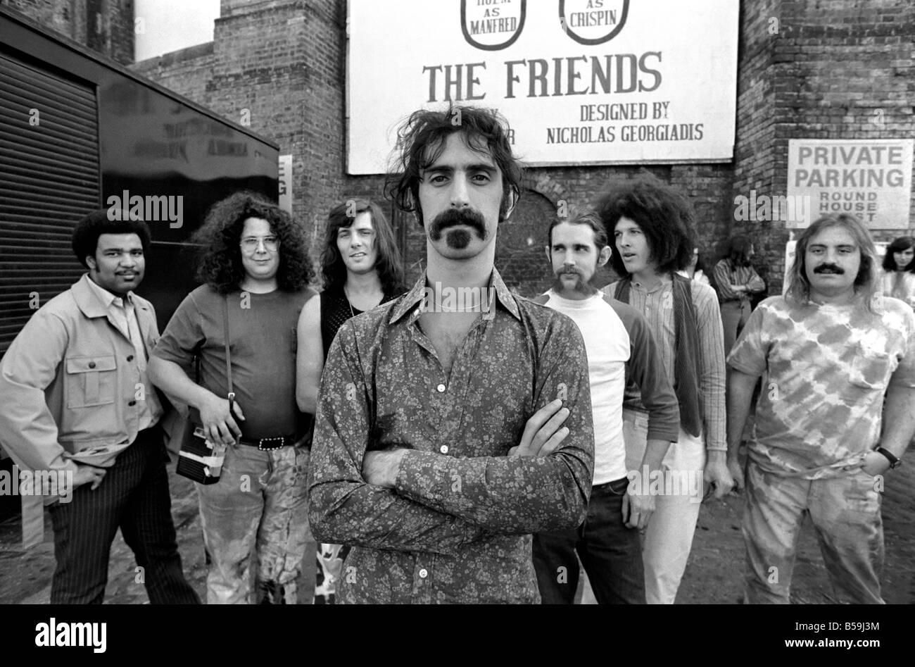 Frank Zappa. Another American rock group hits London town: Frank Zappa and his outfit the Mothers of Invention are at present on tour in the U.K. next weekend they visit the Bath Pop Festival. Yesterday Sunday they saw some of the sights of London, which included a visit to the Round House Entertainment Centre in Camden town. The boys hail from Los Angels: Frank Zappa (foreground), George Duke, Ian Underwood, Jeff Simmons, Mark Volman, Howard Kalen and Aynsley Dunbar. June 1970 70-5893 Stock Photo