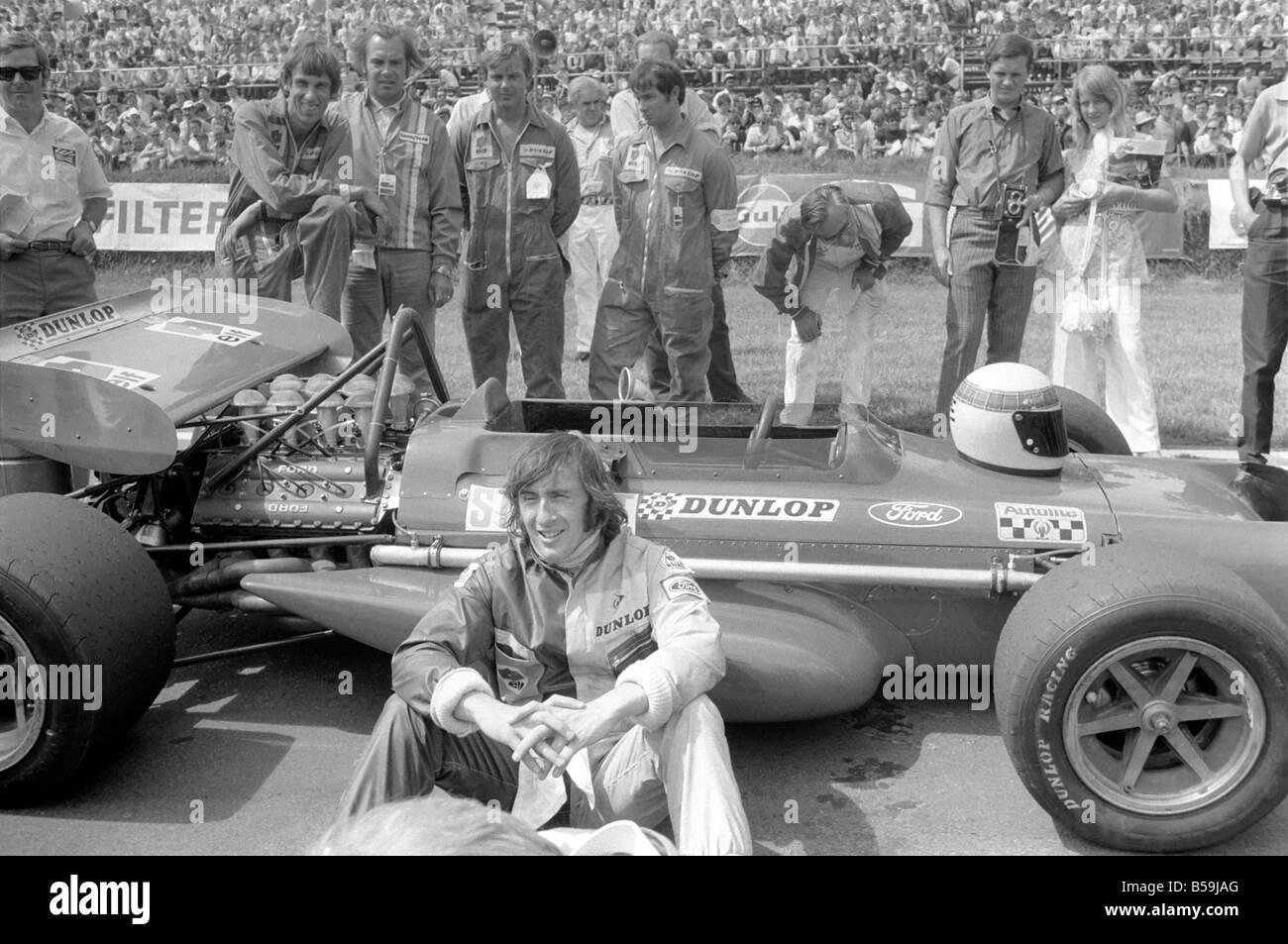 Brands Hatch. Jackie Stewart sitting beside his car before race. July 1970 70-6868-001 Stock Photo