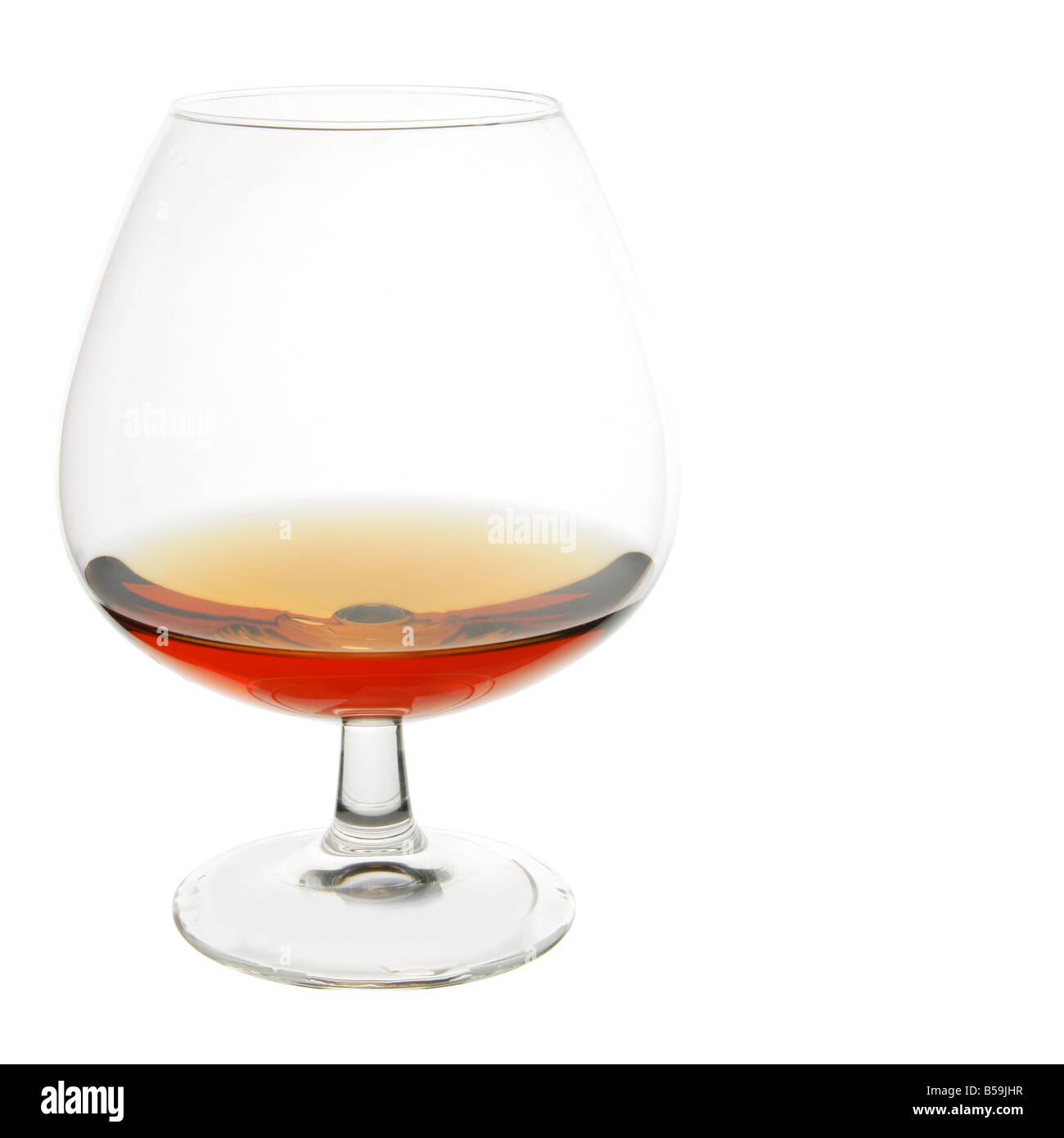 Snifter glass of cognac isolated over white background Stock Photo Alamy